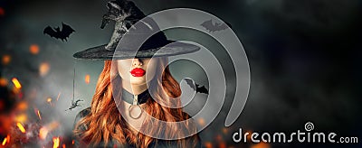 Halloween. witch portrait. Beautiful woman in witches hat with long curly red hair Stock Photo