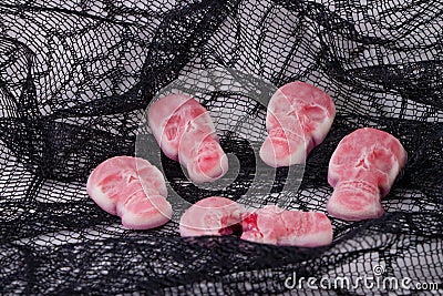 5 Halloween squishy skull candy with one oozing Stock Photo