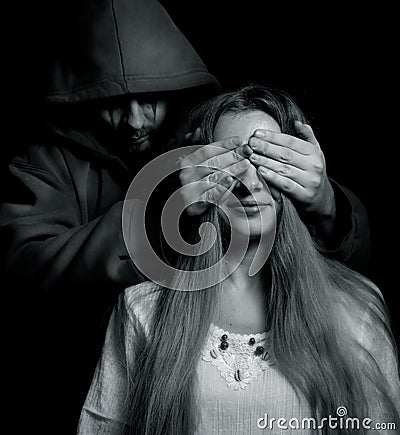 Halloween surprise - evil man behind innocent girl Stock Photo