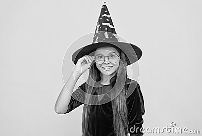 halloween teen girl in witch hat and glasses look like wizard school pupil, happy halloween Stock Photo