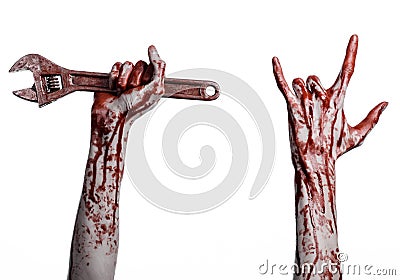 Halloween theme: bloody hand holding a big wrench on a white background Stock Photo