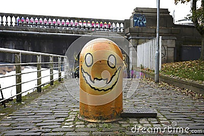 halloween themed orange coloured bollard Stock Photo