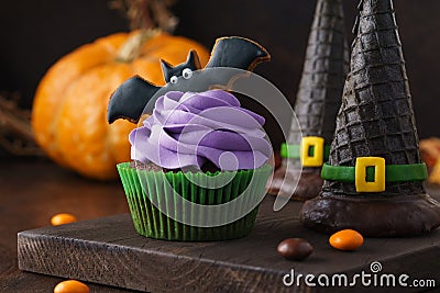 Halloween treats - cupcake, cookie bat and wafer witch hats Stock Photo