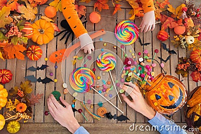 Halloween trick or treat candy and pumpkin. Stock Photo