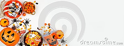 Halloween trick or treat corner border with jack o lantern pails and a selection of candy on a white banner background Stock Photo