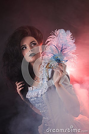 Halloween vampire woman with venetian mask Stock Photo