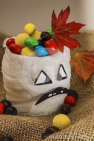 Halloween. Vase for sweets with frightening face Stock Photo