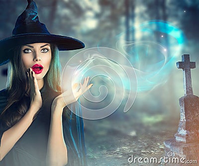 Halloween witch at a dark old spooky cemetery Stock Photo