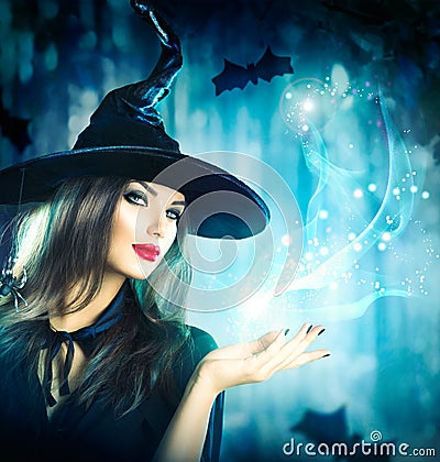 Halloween Witch holding magical light Stock Photo