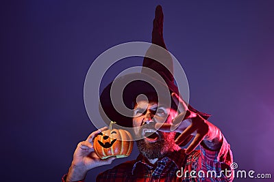 Halloween wizard hipster with scary face and jack o lantern Stock Photo