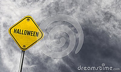 Halloween - yellow sign with cloudy background Stock Photo