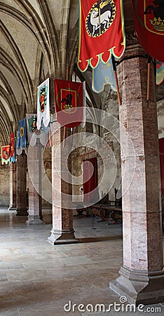 Hallway with flags in a medieval castle Stock Photo
