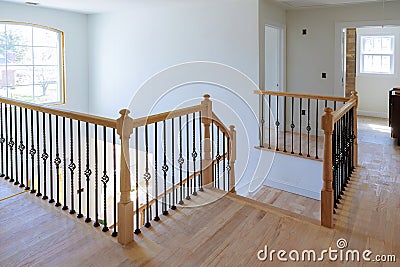 Hallway interior with hardwood floor. View of wooden stairs Stock Photo