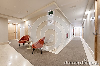 Hallways of a building with cream marble floors Stock Photo