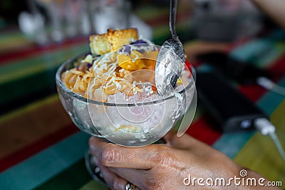Halo-halo is a colorful Filipino beverage of crushed ice an mixtures of bean, jello, milk and many more Stock Photo