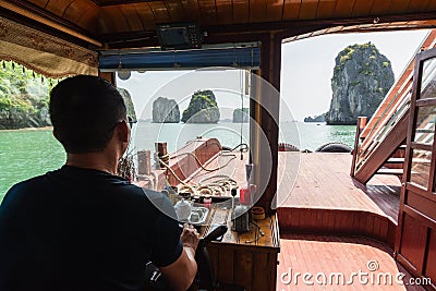 Halong, Vietnam - May 2019: Fishermen village floating among limestone mountains in Halong Bay Editorial Stock Photo