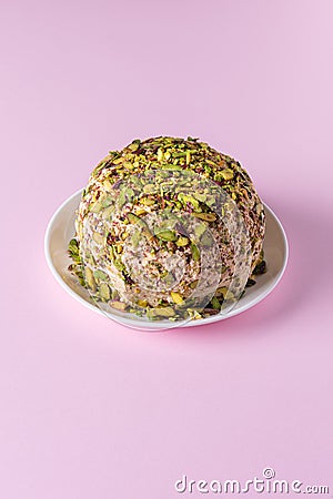 Halva with chopped pistachios on pink with copy space Stock Photo