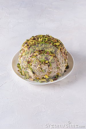 Halva with chopped pistachios on white with copy space Stock Photo
