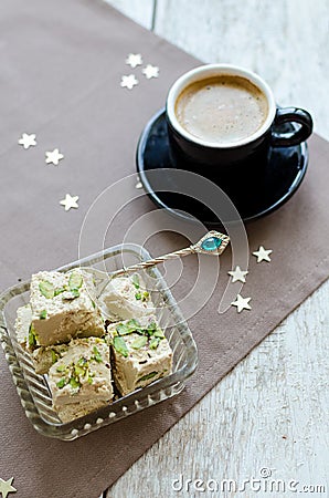 Halva pistachio and cup of coffee Stock Photo