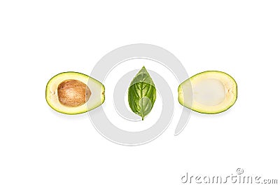 composition of halves of avocado and basil leaf Stock Photo