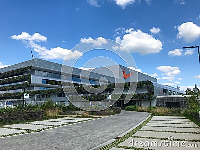 HAM, BELGIUM - February 2020: Nike`s newest EMEA distribution center, Court, with a large green exterior Editorial Stock Photo