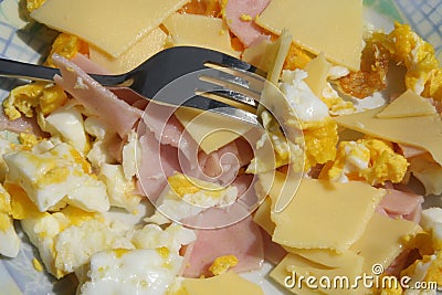 Ham and eggs. Healthy breakfast. Scrambled eggs and ham and cheese. Stock Photo