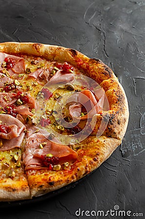 Ham pizza prepared in a wood-fired oven Stock Photo