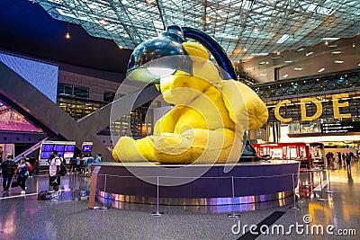 Hamad Airport, Quatar - July 9, 2021: Giant yellow teddy bear installation in Hamad International Airport duty-free hall Editorial Stock Photo