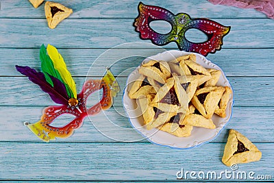 Hamantashen jewish cookies with masks for carnival Stock Photo