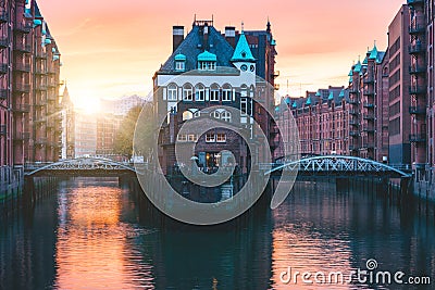 Hamburg city old port, Germany, Europe. Historical famous warehouse district with water castle palace at sunset golden Stock Photo