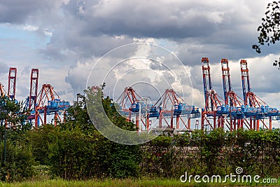 Docks of Port of Hamburg Hamburger Hafen on the river Elbe, Germany. The largest port in Germany and one of the busiest ports in Editorial Stock Photo