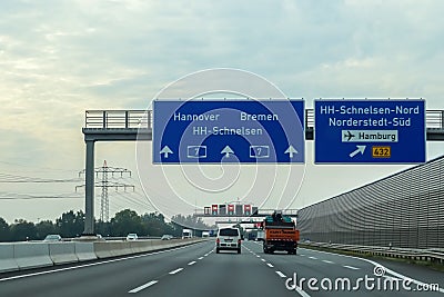 View at traffic signs on the german Highway called A7 from inside a car Editorial Stock Photo