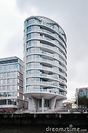 Oval shaped residential tower Oval Am Kaiserkai 10 in Hafencity Editorial Stock Photo