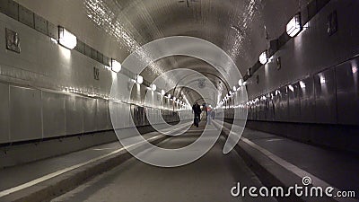 HAMBURG People walk through the old Elbe tunnel in Hamburg Germany. Event with more than 1.5 million visitors & 300 guest ships stock footage HAMBURG People walk through the old Elbe tunnel in Hamburg Germany. Event with more than 1.5 million visitors & 300 guest ships stock footage