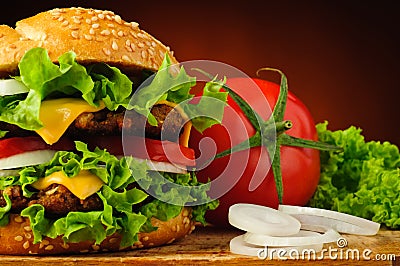 Hamburger closeup and vegetables Stock Photo