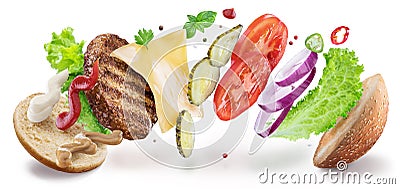 Hamburger ingredients hanging in the air. Colorful conceptual picture of burger cooking. Clipping path Stock Photo