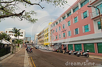 Hamilton, Bermuda - March, 20, 2016: street road. City street road. Cars and scooters parked along side of street road Editorial Stock Photo