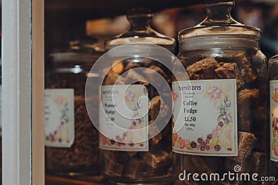 Hamiltons fudge in jars in a window of a shop in Broadway, Cotswolds, UK Editorial Stock Photo