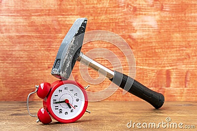 Hammer breaking classic alarm clock Stock Photo