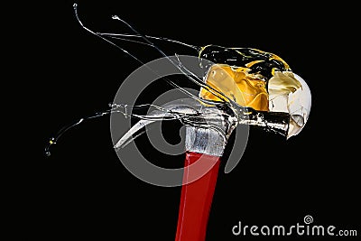 Hammer breaking eggs on black background Stock Photo