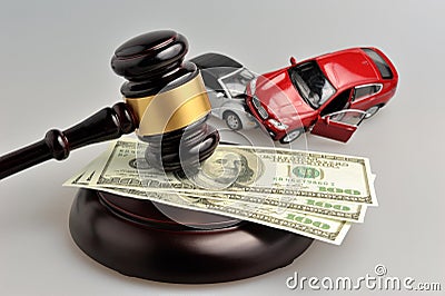 Hammer of judge with money and toy cars on gray Stock Photo