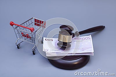 Hammer of judge, pushcart and euro money on white Stock Photo