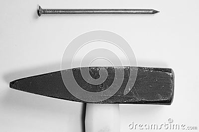 Hammer with a nail isolated on white background Stock Photo