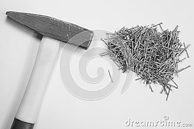 Hammer with nails isolated on white background Stock Photo