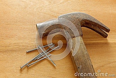 Hammer ,nails on wood background. Stock Photo