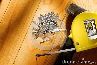 Hammer, tape measure and nails Stock Photo