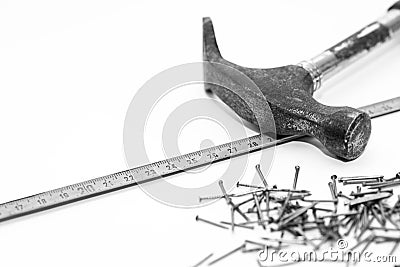 Hammer, tape measurer, small nails, conceptual construction, renovation image Stock Photo