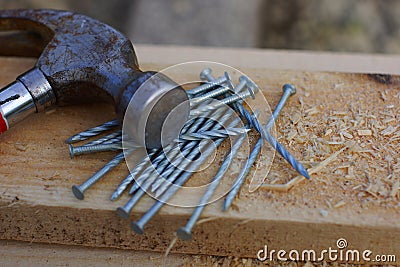 Hammer and twisted nails . Stock Photo