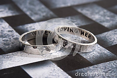 Hammered Rings on Black Desiger Background Stock Photo