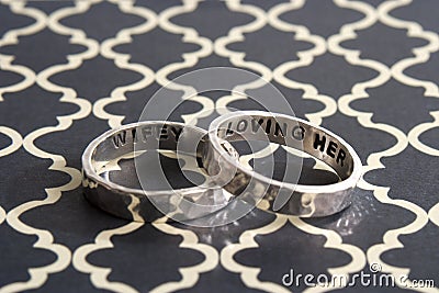 Hammered Rings on Black Design Background Stock Photo